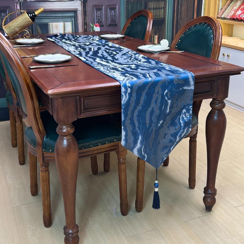 cloudy lines jacquard table runner with tassels