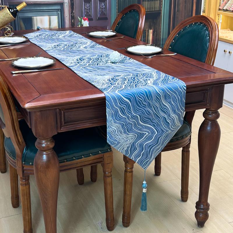 stain face rolling jacquard table runner with tessels